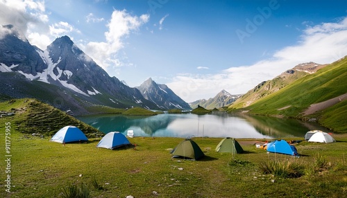 Camping on green land with lake and mountains