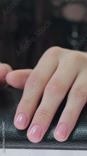 Female hands with beautiful natural elegant manicure. Manicure in a luxury beauty SPA salon. Concept nails and hands care 