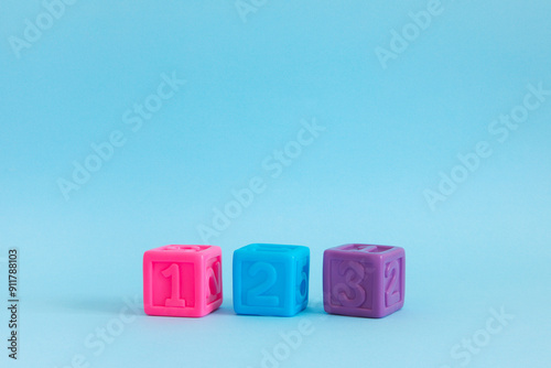 Сolorful plastic cubes with numbers lined up 