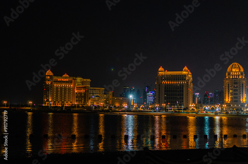 Night view of Doha Corniche from Qatara photo