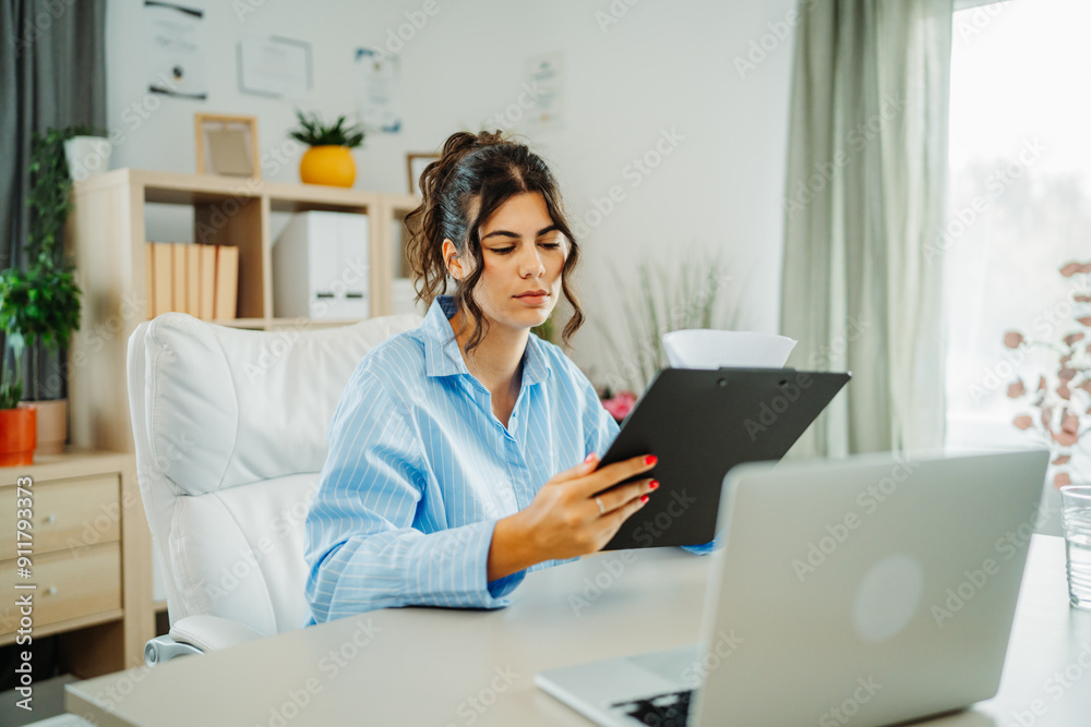 Young caucasian business woman working in office on laptop Young caucasian business woman working in office on laptop