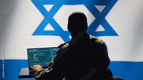 Israel intelligence agency operator uses program deploying bots on social networks, smearing political opponents. Israeli Mossad agent engages in cognitive warfare using troll accounts, camera A photo