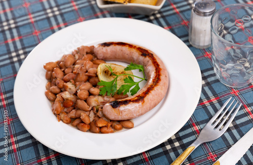 Top view of Catalan stewed beans with butifarra sausage photo