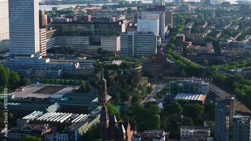 Aerial view of Museum Boijmans Van Beuningen with its modern green architecture, urban planning, and bustling streets. Tall buildings and green areas contrast in a European city photo