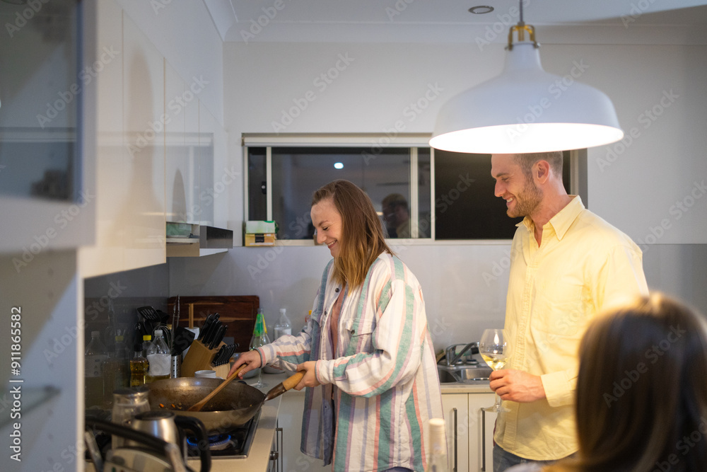Friends cooking together at home Friends cooking together at home