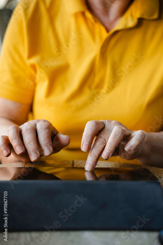 Woman typing on a tablet photo