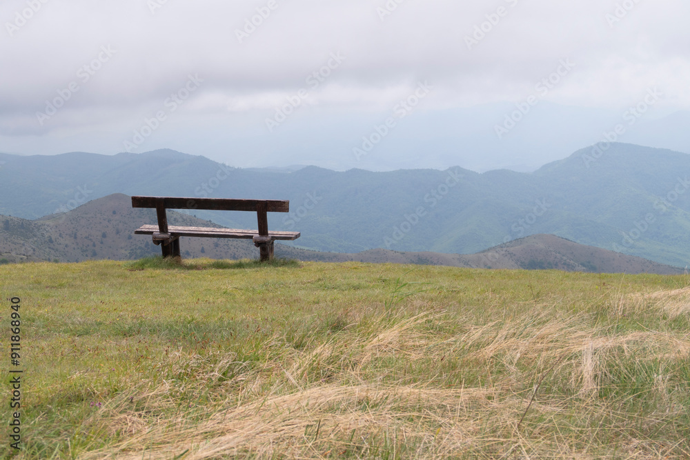 Bench with a mountain landscape view Bench with a mountain landscape view