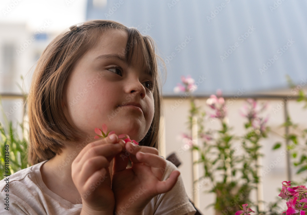 Girl With Down Syndrome With Flowers On Balcony
Girl With Down Syndrome With Flowers On Balcony