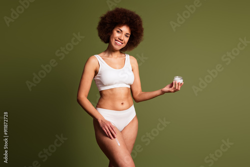 No retouch photo of pretty cute lady underwear lingerie applying body lotion emtpy space isolated green color background