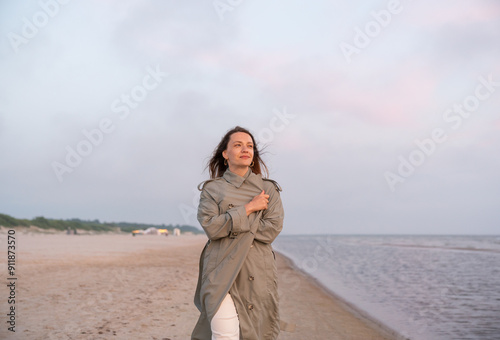 Woman Walking At The Beach photo