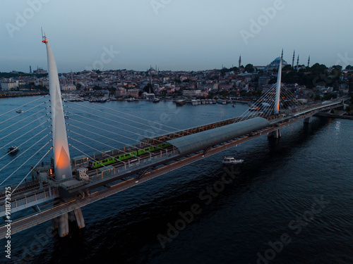 Golden Horn Metro Bridge in Istanbul at Dusk photo