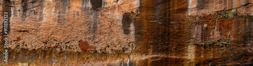 Pano of beautiful striated red canyon rock walls in Zion National Park