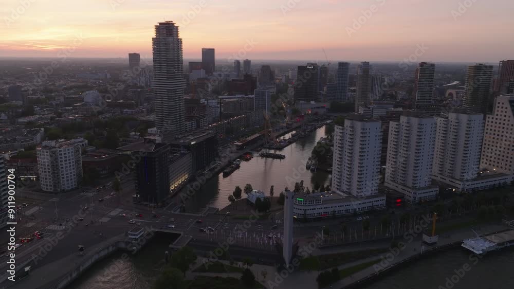 Aerial view of Rotterdam cityscape at sunrise. Skyscrapers, bridges, and the river create a stunning urban scene from above Aerial view of Rotterdam cityscape at sunrise. Skyscrapers, bridges, and the river create a stunning urban scene from above