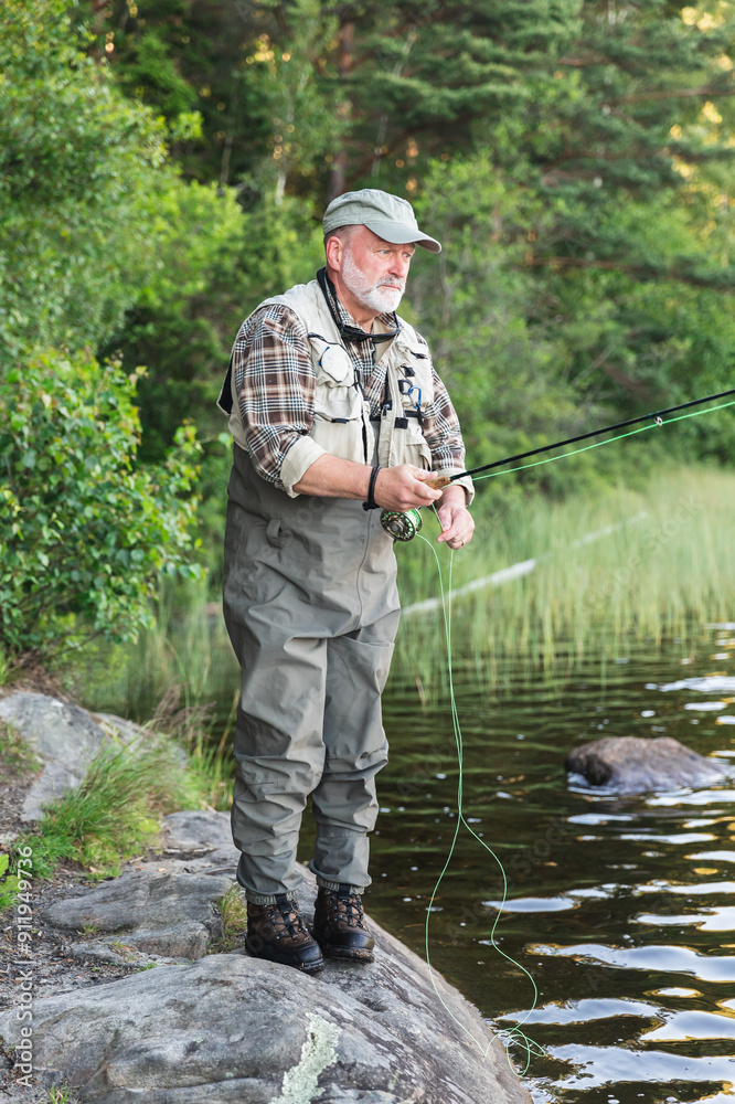 Fisherman Standing in Lake Amidst Scenic Wilderness Fisherman Standing in Lake Amidst Scenic Wilderness