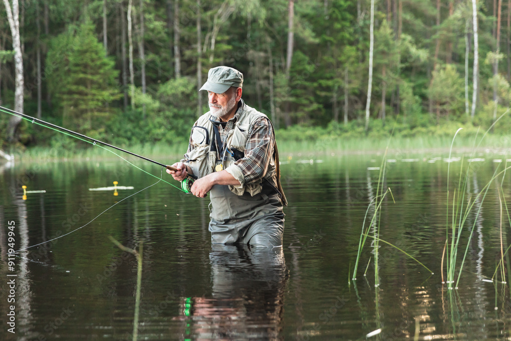 Fisherman Standing in Lake Amidst Scenic Wilderness Fisherman Standing in Lake Amidst Scenic Wilderness
