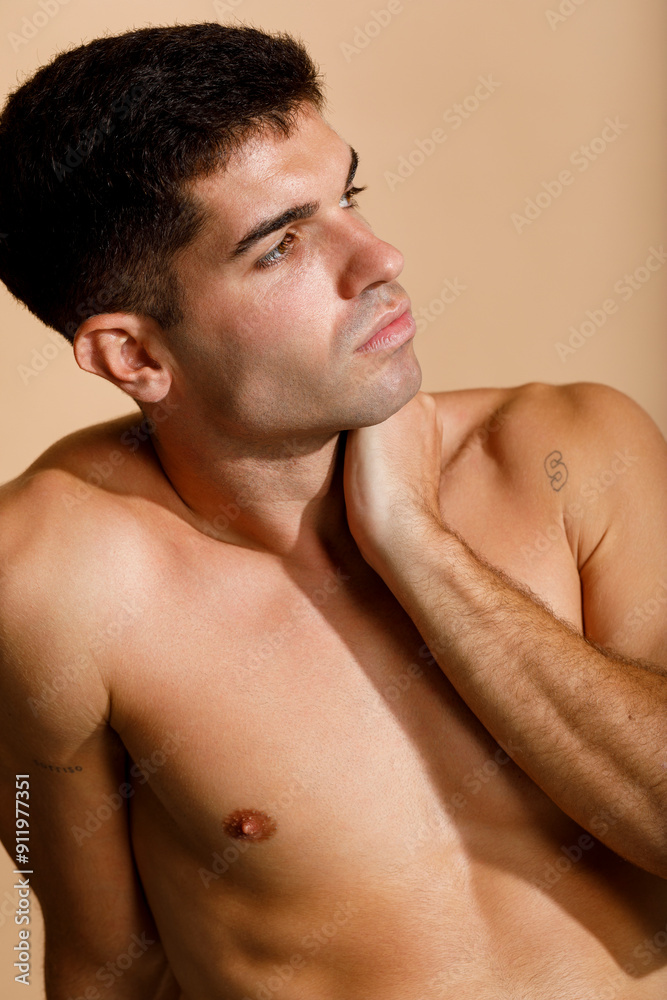 Shirtless Man Posing In Studio. Shirtless Man Posing In Studio.