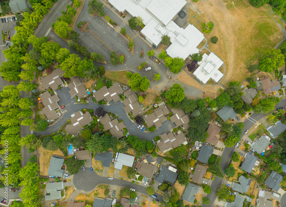 Fototapeta premium Aerial view of car parking, green bushes. Construction, infrastructure, road transport, landscaping of infrastructure facilities.