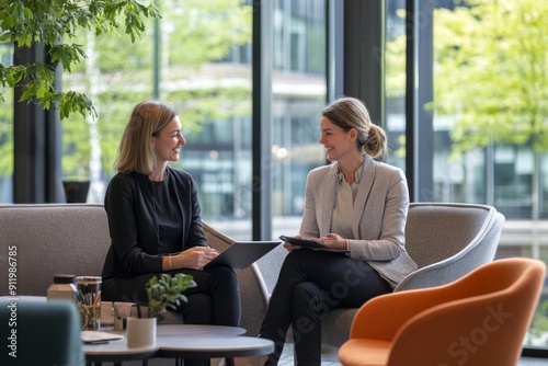 senior businesswoman mentoring a young female colleague