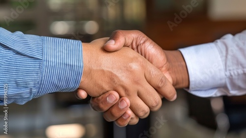 Businessmen shaking hands symbolizing agreement and partnership in a corporate setting