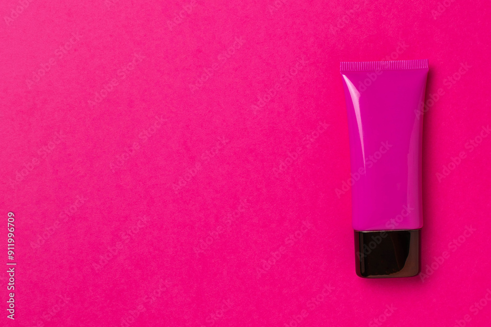 Bright Pink Cosmetic Tube on Vibrant Pink Background - Beauty Product Mockup Bright Pink Cosmetic Tube on Vibrant Pink Background - Beauty Product Mockup