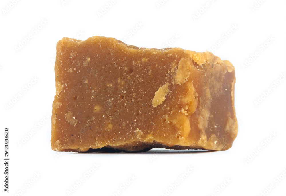pieces of artisanal sugar cane panela on an isolated white background pieces of artisanal sugar cane panela on an isolated white background