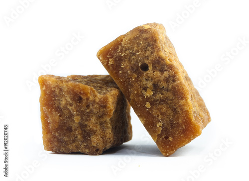 pieces of artisanal sugar cane panela on an isolated white background