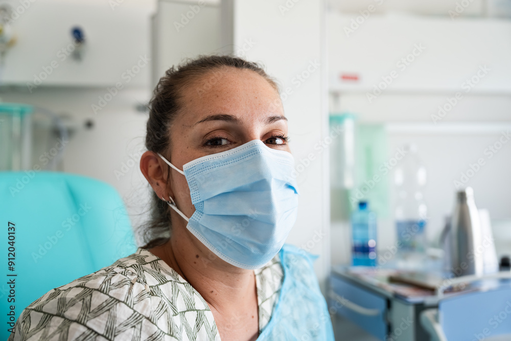 woman wearing protective face mask smiling in hospital woman wearing protective face mask smiling in hospital