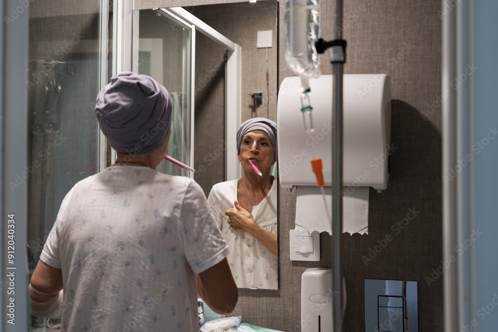 Patient brushing teeth in hospital bathroom recovering from illness