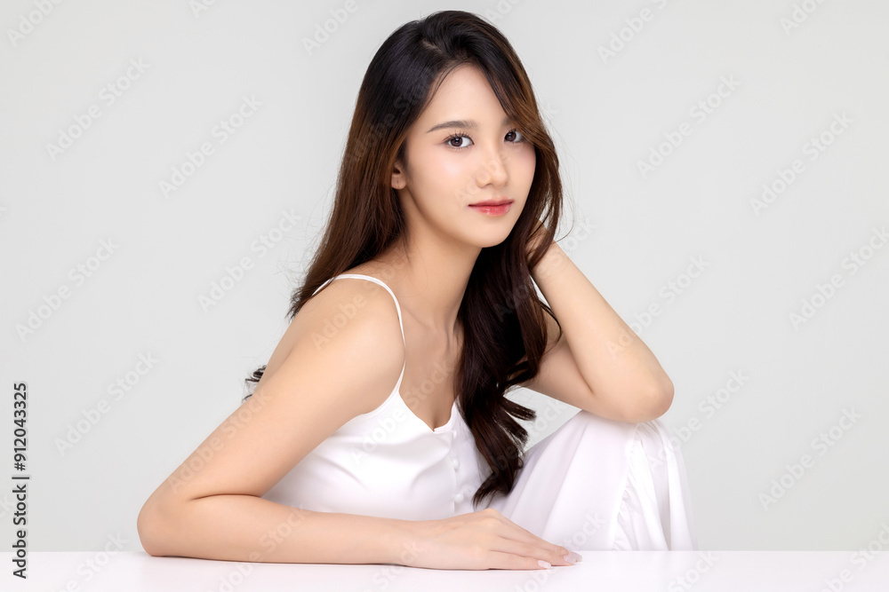 Beautiful young Asian woman with natural beauty make up style shows healthy and perfect skin on isolated background. Facial and skin care concept for commercial advertising. Beautiful young Asian woman with natural beauty make up style shows healthy and perfect skin on isolated background. Facial and skin care concept for commercial advertising.