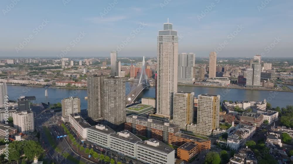 Aerial view of Rotterdam's skyline, showcasing modern architecture of De Zalmhaven residential tower, skyscrapers, bridges, and rivers. Urban, travel, and real estate projects Aerial view of Rotterdam's skyline, showcasing modern architecture of De Zalmhaven residential tower, skyscrapers, bridges, and rivers. Urban, travel, and real estate projects