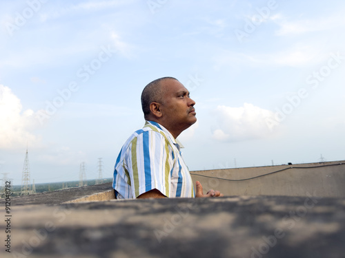 Portrait of a middle aged Indian man at outdoors photo