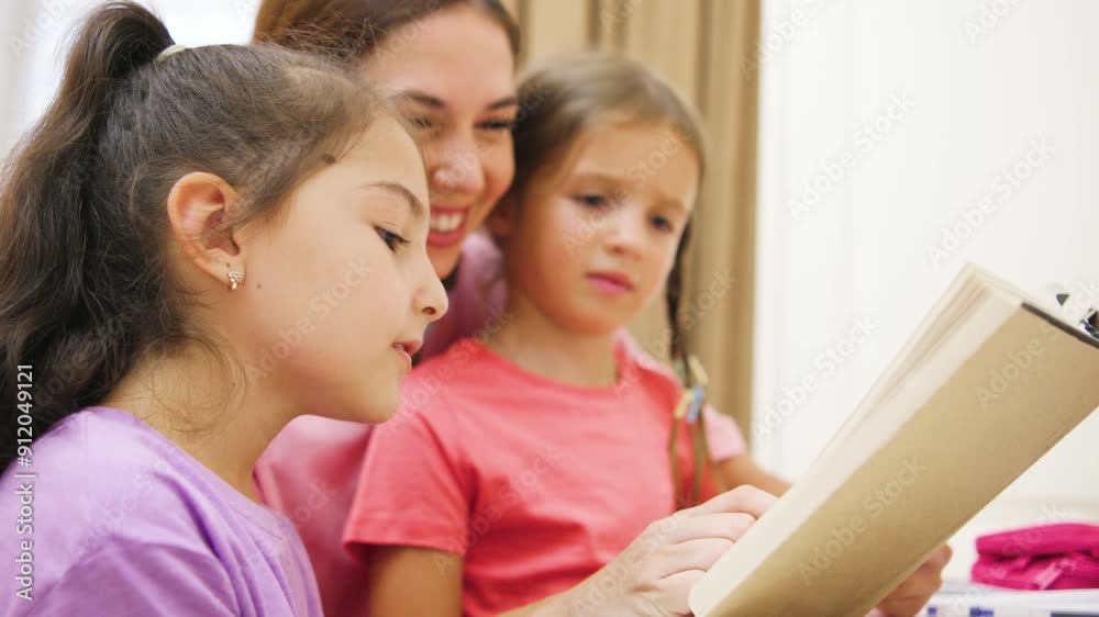 A loving, caring mother reads a book aloud to her wonderful daughters, creating unforgettable memories and strengthening bonds. A loving, caring mother reads a book aloud to her wonderful daughters, creating unforgettable memories and strengthening bonds.