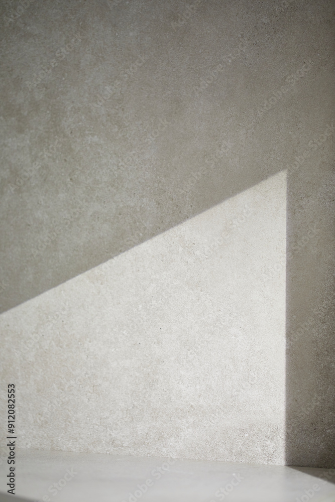 A gray-toned tile background with various props with sunlight coming through the window. A gray-toned tile background with various props with sunlight coming through the window.