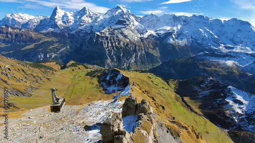 Autumn landscape in the mountains in Switzerland showing aerial cableway from Murren to Schilthorn Mountain in the Bernese Alps of Switzerland