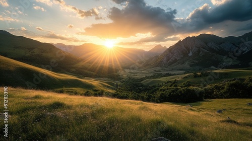 Sun setting behind rugged mountain range casting long shadows across a serene valley below