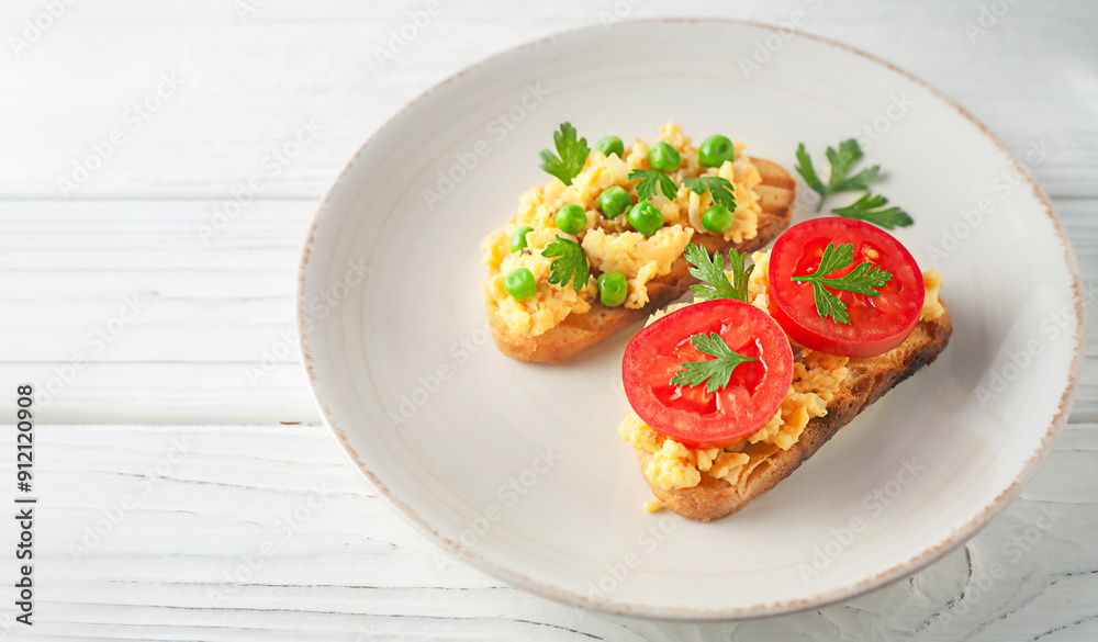 Scrambled Eggs on toasts, top view, copy space. Homemade breakfast - scrambled eggs sandwiches. Scrambled Eggs on toasts, top view, copy space. Homemade breakfast - scrambled eggs sandwiches.