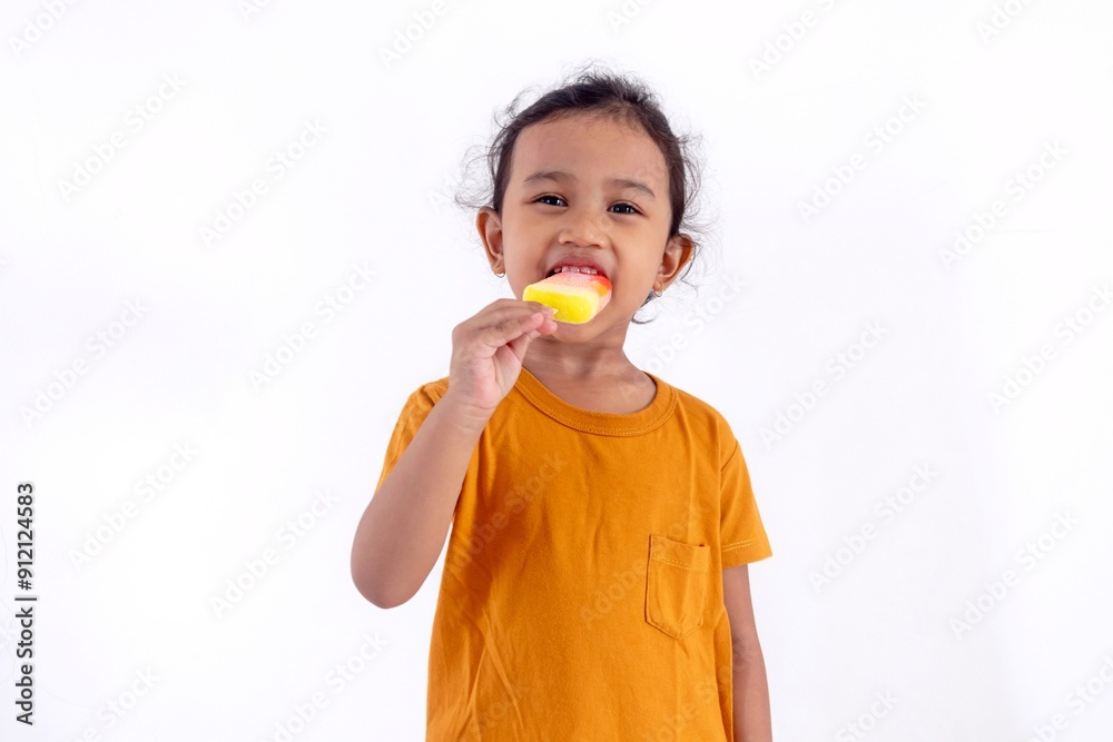 A happy little Asian girl enjoying an ice cream, on a white background A happy little Asian girl enjoying an ice cream, on a white background