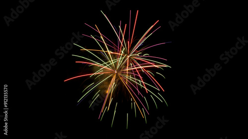 Fireworks Confetti. Beautiful close-up color photo of multi colored fireworks exploding against a black night sky. Copy space.