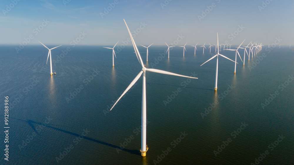 Majestic Windmill Park Amidst Tranquil Waters in the Netherlands Majestic Windmill Park Amidst Tranquil Waters in the Netherlands