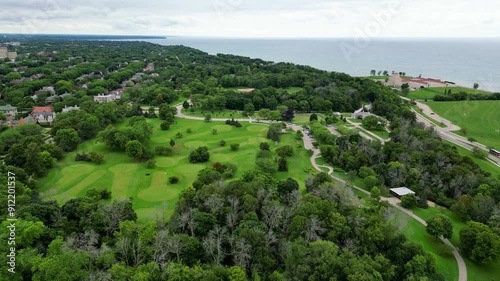 Lake Park, Wisconsin Overlooking Lake Michigan; Milwaukee County Parks And Recreation. 4K Aerial Reverse Over The Golf Course And Lighthouse. photo