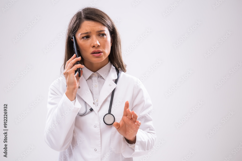 Portrait of doctor who is talking on phone with patient. Portrait of doctor who is talking on phone with patient.