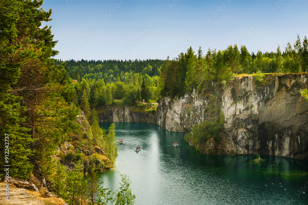 Ruskeala mountain park with marble canyon on a sunny summer day. Republic of Karelia, Russia Ruskeala mountain park with marble canyon on a sunny summer day. Republic of Karelia, Russia