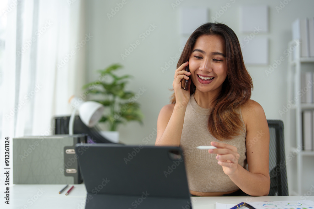 Asian businesswoman using laptop, online and smartphone to contact customers Business ideas in the office Data analysis, plans, marketing, calculations, accounting, auditing. Asian businesswoman using laptop, online and smartphone to contact customers Business ideas in the office Data analysis, plans, marketing, calculations, accounting, auditing.