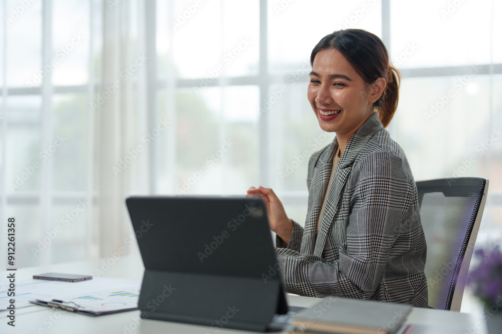 Young Asian businesswoman uses a calculator to calculate business principles. Accounting statistical concepts at the office starting a financial business, calculating accounting online marketing. Young Asian businesswoman uses a calculator to calculate business principles. Accounting statistical concepts at the office starting a financial business, calculating accounting online marketing.
