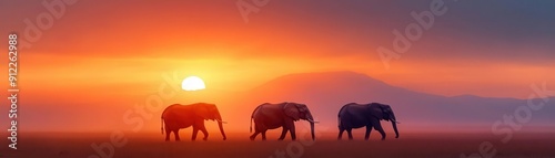 Majestic elephants stroll across a serene landscape at sunset, with vibrant hues reflecting nature's beauty.