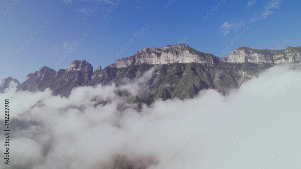 Flying between clouds and the orbital view of a mountain Flying between clouds and the orbital view of a mountain