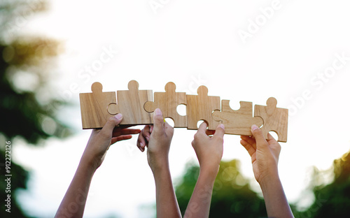 Jigsaw puzzle of unity, cooperation among groups, teamwork, team connection and support