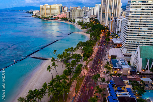 Honolulu Marathon Runners Running Down Kalakaua Avenue in Waikiki, Honolulu, Hawai'i photo