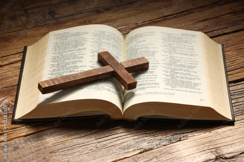 Fototapeta premium Bible and cross on wooden table. Religion of Christianity