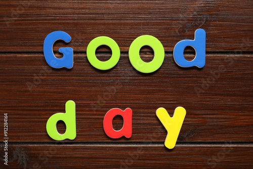 Wallpaper Mural Words Good Day made of magnetic letters on wooden background, flat lay. Learning alphabet Torontodigital.ca